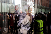 Protest in front of the residence of the University of Michigan's president, in Ann Arbor