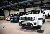 Jeep vehicles are displayed at the showroom of a car dealership in Milan