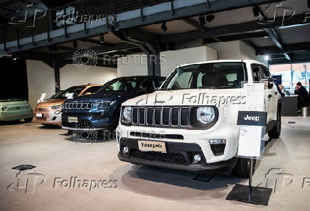 Jeep vehicles are displayed at the showroom of a car dealership in Milan