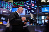 Traders work on the floor of the NYSE in New York