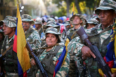 Members of the Bolivarian Militia and supporters of President Nicolas Maduro march to plead allegiance