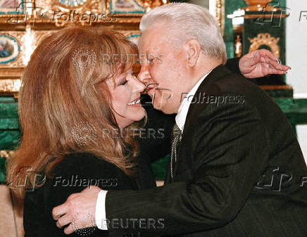 FILE PHOTO: Russian President Boris Yeltsin kisses pop singer Alla Pugacheva