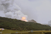 A fire that broke out during an engine combustion test of its Epsilon S rocket under development is seen at Tanegashima Space Center