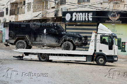 Palestinian security forces operate at the camp in Jenin