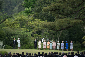 Japan's Emperor Naruhito and Empress Masako attend the spring garden party at the Akasaka Palace Imperial garden, in Tokyo