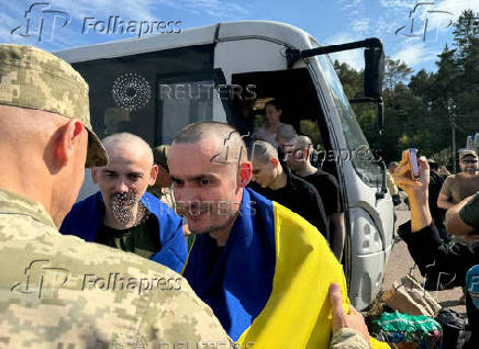 Ukrainian POWs are seen after a swap at an unknown location in Ukraine