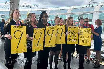 United Airlines flight attendants picket while negotiating a new labor agreement at O'Hare International Airport