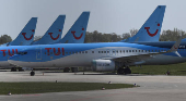 FILE PHOTO: Planes of the German carrier Tui are parked on a closed runway during the spread of the coronavirus disease (COVID-19) at the airport in Hanover,