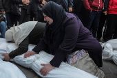 Palestinians mourn their dead at Deir Al Balah hospital after Israeli airstrike in central Gaza