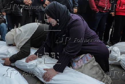 Palestinians mourn their dead at Deir Al Balah hospital after Israeli airstrike in central Gaza