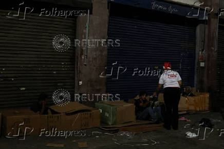 Anjos da Noite (Night Angels) NGO distributes food to homeless people on Christmas Eve in Sao Paulo