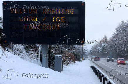 A sign displays a warning at the side of the A9 near Aviemore, Scotland