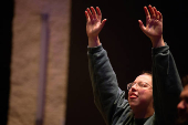 Worshipers at Blackhawk Church gather to pray for victims and survivors of a shooting in Madison