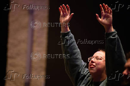 Worshipers at Blackhawk Church gather to pray for victims and survivors of a shooting in Madison