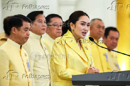 Thailand's Prime Minister Paetongtarn Shinawatra and her cabinet members attend a press conference in Bangkok