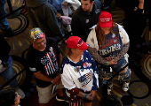 Supporters wait in line to see Tulsi Gabbard and Robert F. Kennedy Jr. take part in a moderated discussion with actor Zachary Levi in Dearborn