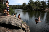 People cool off at Lake Parramatta, near Sydney