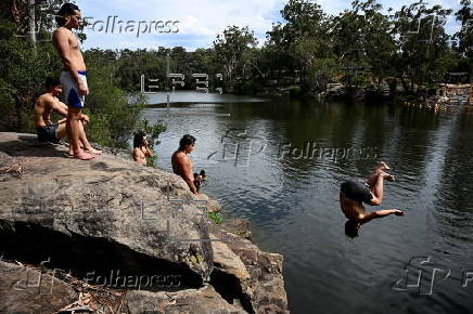 People cool off at Lake Parramatta, near Sydney