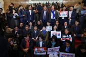 Lawmakers gather to block the entry of South Korean President Yoon Suk Yeol from entering the National Assembly in Seoul