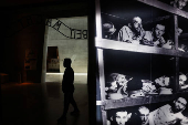 Visitors tour an exhibition ahead of Israel's national Holocaust memorial day, at Yad Vashem in Jerusalem