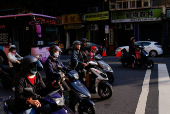 Drivers wait for the traffic light in Taipei