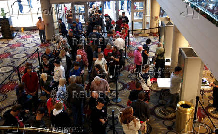 Supporters go thru security before seeing Republican vice presidential nominee JD Vance and Robert F. Kennedy Jr. take part in a moderated discussion with actor Zachary Levi in Dearborn