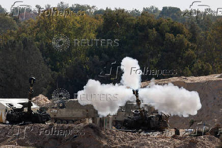 Israeli military vehicles manoeuvre inside the Gaza Strip, in southern Israel