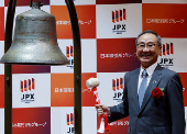 Akiyoshi Yamamura, President of Tokyo Metro, smiles after ringing a bell at a ceremony to mark the company's debut on the Tokyo Stock Exchange in Tokyo