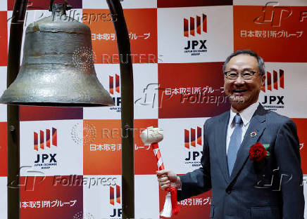 Akiyoshi Yamamura, President of Tokyo Metro, smiles after ringing a bell at a ceremony to mark the company's debut on the Tokyo Stock Exchange in Tokyo