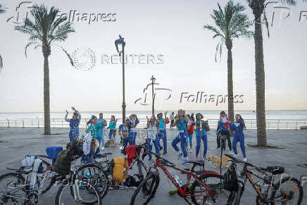 Women dance at the seafront in Beirut