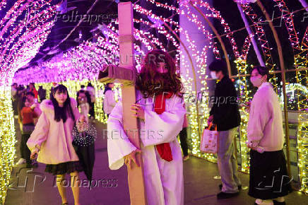 A person dresses up as Jesus at a Christmas theme park in New Taipei City