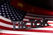 FILE PHOTO: Illustration shows TikTok logo, U.S. and Chinese flags