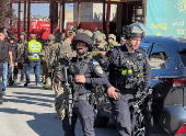 Israeli security and rescue personnel at the scene of a shooting attack on a car and bus where at least three Israelis were killed near Kedumim in the Israeli-occupied West Bank