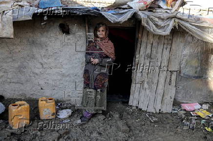 Afghans living in a camp amidst drop in temperatures in Kabul