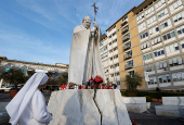 Members of the media gather outside the Gemelli Hospital where Pope Francis is admitted to continue treatment for ongoing bronchitis, in Rome