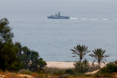 An Israeli military ship patrols off Zikim beach, in Israel
