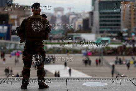 FILE PHOTO: Armed French soldier patrols at the esplanade of La Defense near Paris