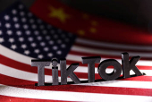 Illustration shows TikTok logo, U.S. and Chinese flags