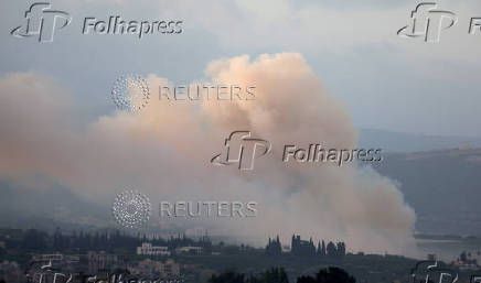 Smoke rises on the Lebanese side of the border with Israel, as seen from Tyre