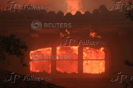 Smoke billows from the Mountain Fire, in California