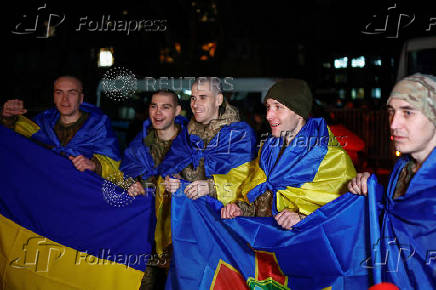 Ukrainian prisoners of war (POWs) return after a swap, in an undisclosed location