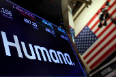 FILE PHOTO: A screen displays the logo and trading information for Humana on the floor of the NYSE in New York