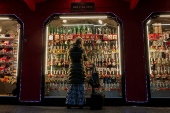 A woman looks at holiday ornaments at a pop-up Holiday shop in New York City