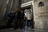 People walk through the Holy Door at Rome's Basilica of Saint Mary Major