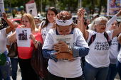 Relatives of detained Venezuelans protest, outside the public prosecutor's headquarters, in Caracas