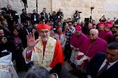 The Latin Patriarch of Jerusalem, Pierbattista Pizzaballa, leads a mass at the Church of Nativity in the Old City of Bethlehem