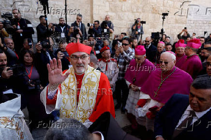 The Latin Patriarch of Jerusalem, Pierbattista Pizzaballa, leads a mass at the Church of Nativity in the Old City of Bethlehem