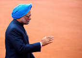 FILE PHOTO: Indian PM Singh arrives to attend the ceremonial reception of German President Gauck at the forecourt of the presidential palace in New Delhi