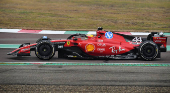 Lewis Hamilton drives a Ferrari F1 car around the Fiorano circuit as part of the TPC tests