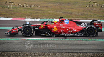 Lewis Hamilton drives a Ferrari F1 car around the Fiorano circuit as part of the TPC tests